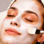 Facial mask being applied with a brush